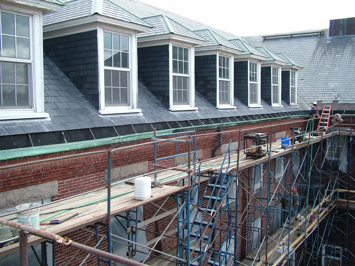 Long Island Shelter, Long Island MA Scope of Work: - Remove and replace broken/missing slate tiles across 30,000 sq. ft. of roof - Replace copper gutters and downspouts - Repoint 65,000 sq. ft. of roof