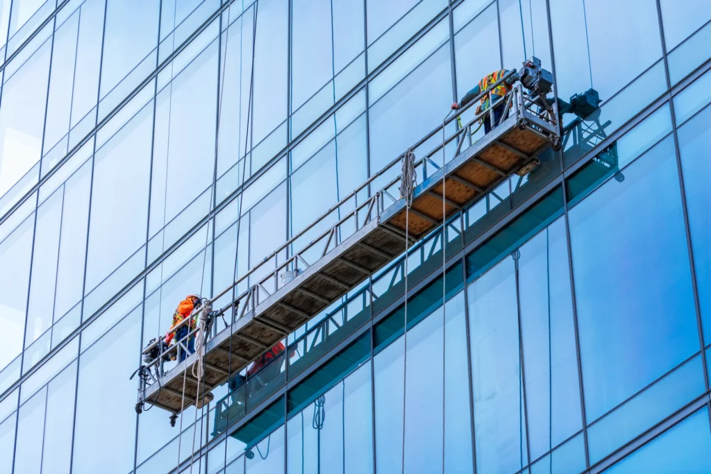 waterproofing experts on a hanging scaffolding rig