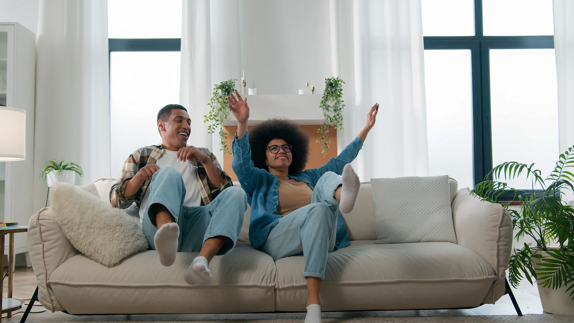 happy customers jumping for joy on their couch