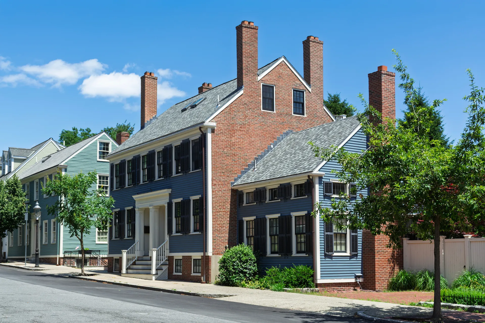 brick house with clapboard siding
