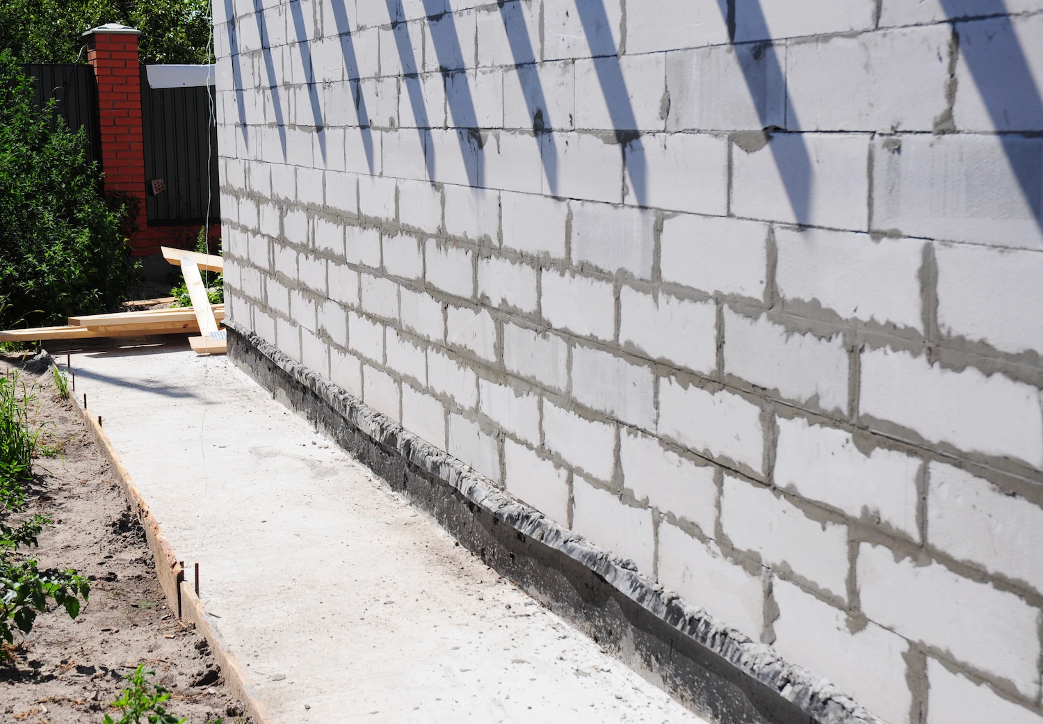 freshly recreated masonry foundation concrete wall.